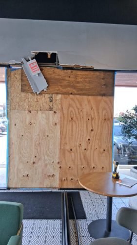 BEFORE: Boarded Storefront Awaiting Glass Replacement — Houston TX