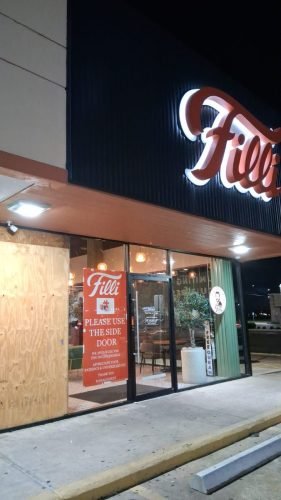 BEFORE: Commercial Storefront Boarded at Night — Houston TX