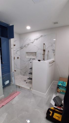 DURING: Frameless Shower Glass Installation, Marble-Look Tile — Houston TX