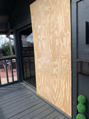 Commercial Glass Door Boarded Up Awaiting Replacement — Houston TX
