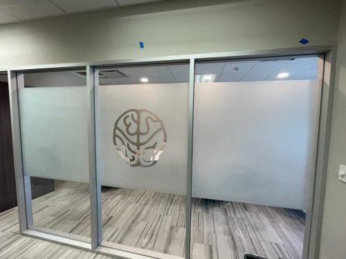 AFTER: Office Glass Partition with Frosted Band and Etched Logo — Houston TX