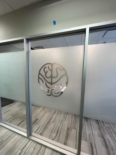 AFTER: Frosted Glass Office Partition, Etched Logo Detail — Houston TX